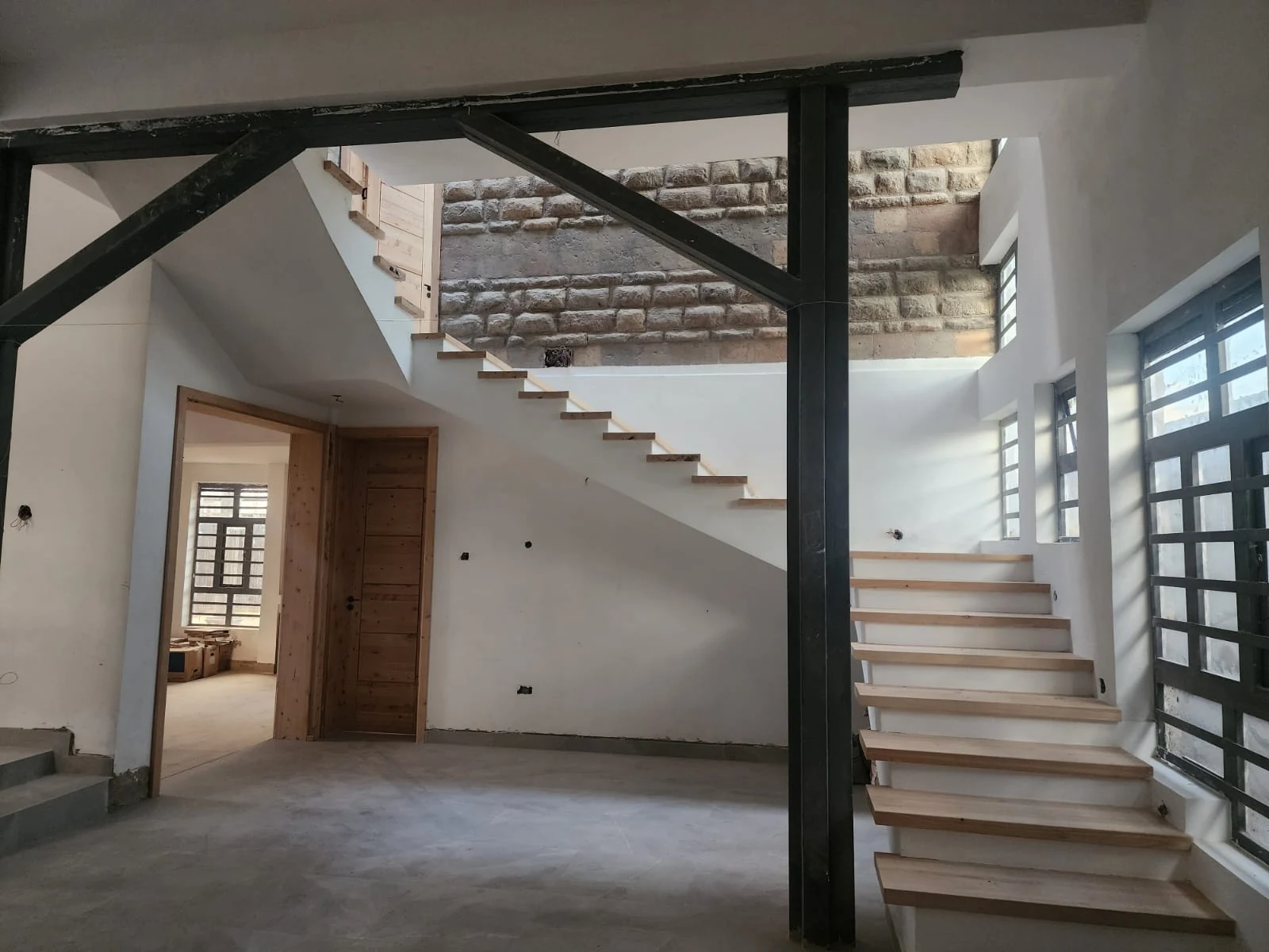 Interior finishing and staircase installation by Mayboke Construction